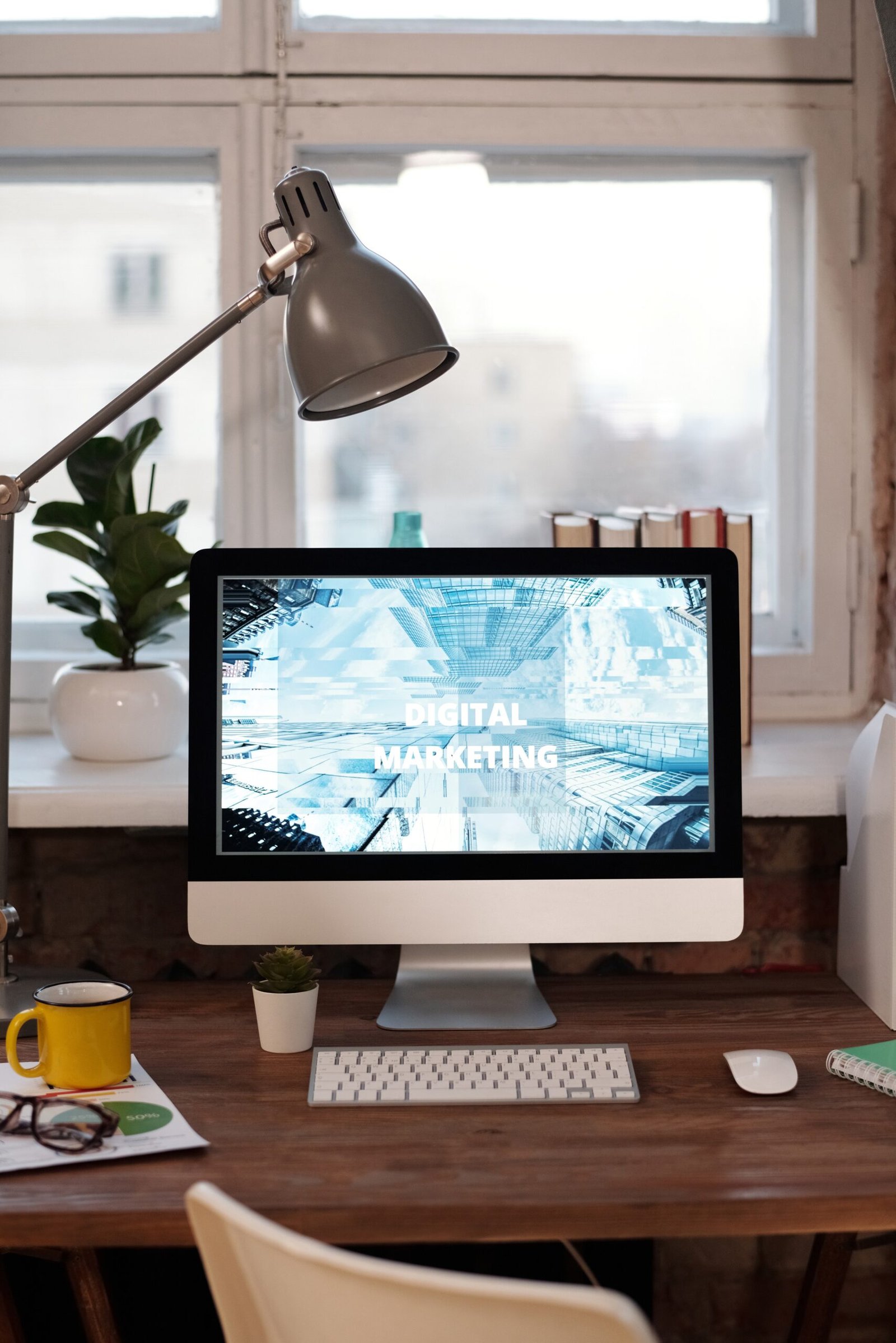 silver-imac-on-brown-wooden-table